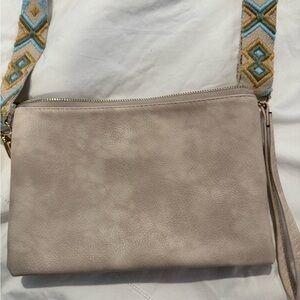 Elegant Beige Crossbody Bag with Patterned Strap